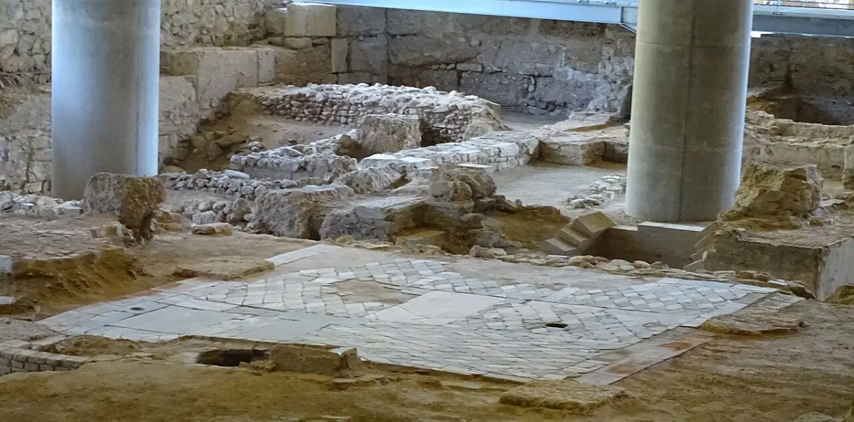 A glass floor at the entrance to the Acropolis Museum with an excavated ancient Athenian neighbourhood visible beneath it