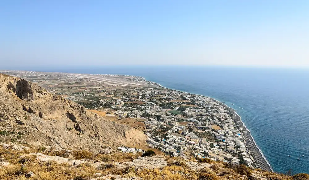 The view down from the ridge of Mesa Vouno at Ancient Thera over Kamari, its black beach and the coastal plain below