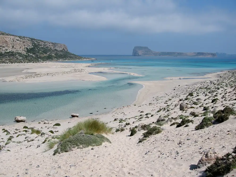 The Balos lagoon in north-west Crete, a sandbar separating shallow turquoise water from the open sea with an islet on the horizon