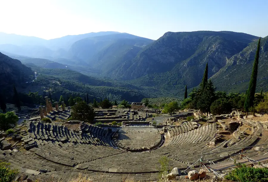 The terraced ruins of the sanctuary of Apollo on the slope of Mount Parnassus above the olive plain