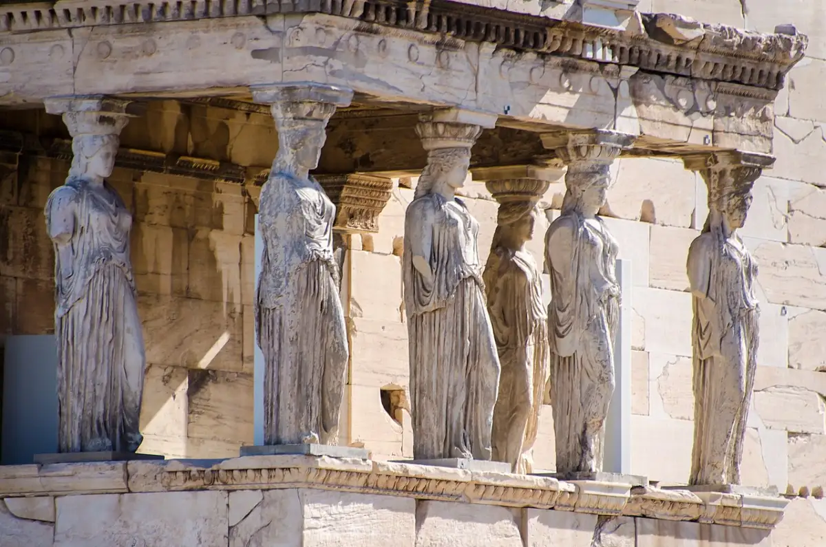 The six carved female figures of the Erechtheion porch carrying the roof above them