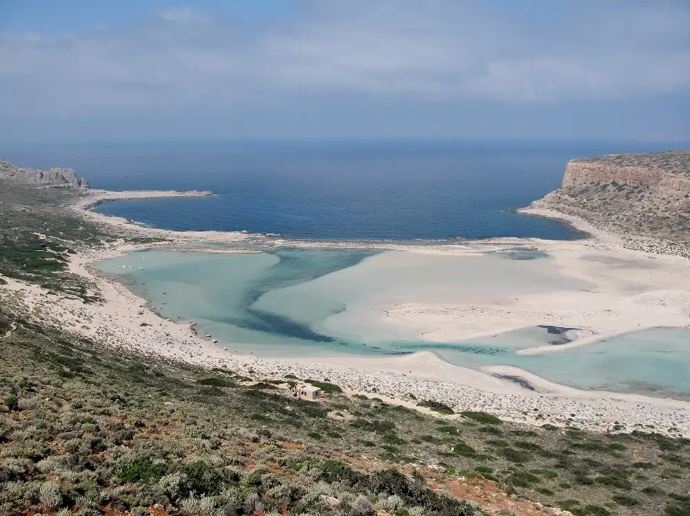 The turquoise lagoon and pale sand spit of Balos at the north-west tip of Crete, seen from the hill above
