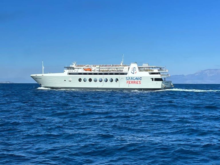 A large white ferry crossing the open Aegean Sea