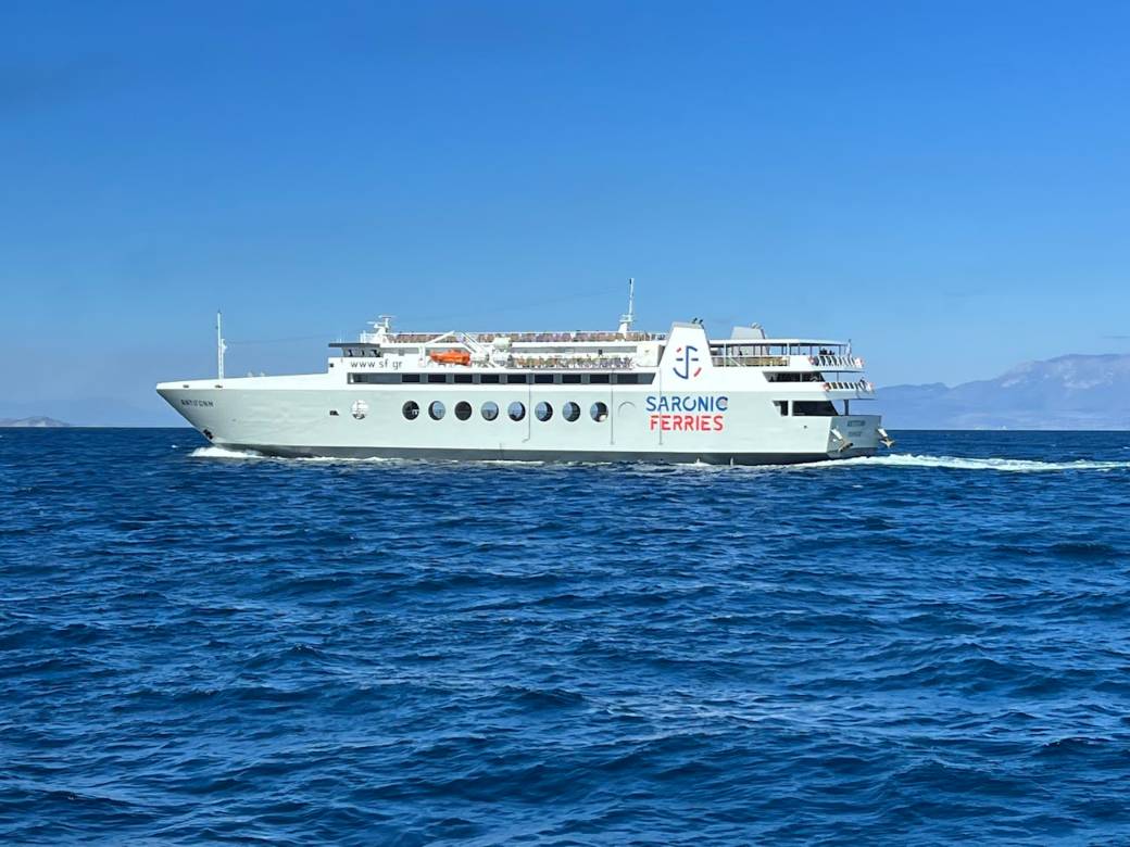 A large white ferry crossing the open Aegean Sea