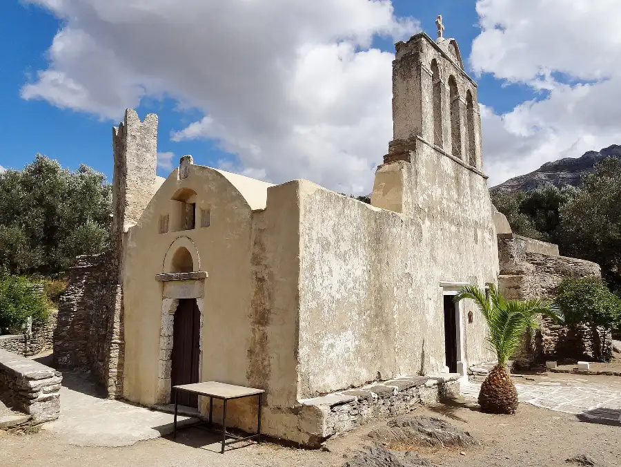 The old stone church of Panagia Drosiani near Moni in the Naxos interior, with olive trees and mountains behind