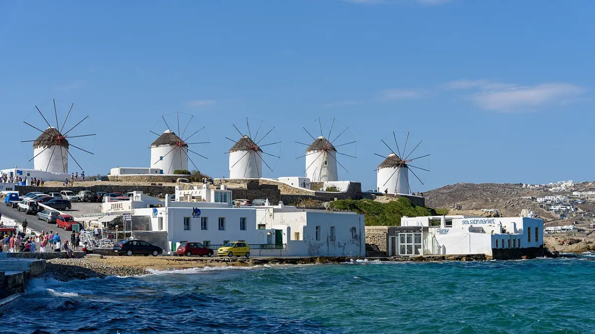 The row of white windmills above Mykonos Town, the Kato Mili line on the ridge above the sea