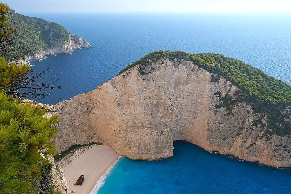 Navagio cove and the shipwreck on its sand, seen from the clifftop viewpoint above