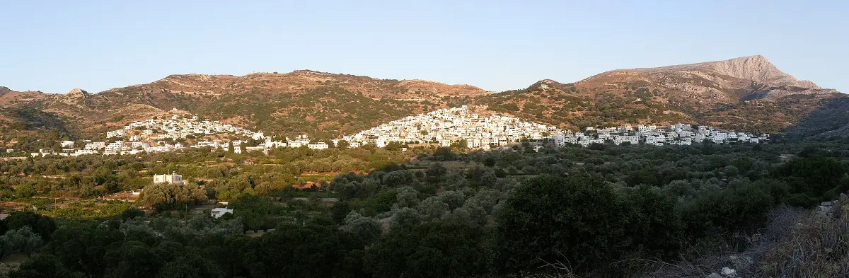 The village of Filoti spread across a hillside below the bare grey slopes of Mount Zas on Naxos