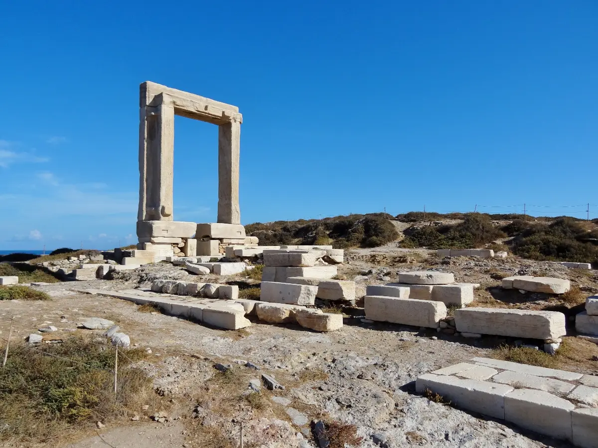 The Portara, a freestanding marble doorway on the islet of Palatia at Naxos, against a clear sky