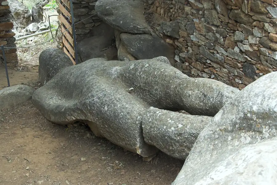 A colossal unfinished archaic kouros lying on its back in the quarry ground at Flerio, Naxos.