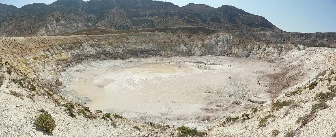 The pale floor of the Stefanos crater on Nisyros, with sulphur staining and steam vents