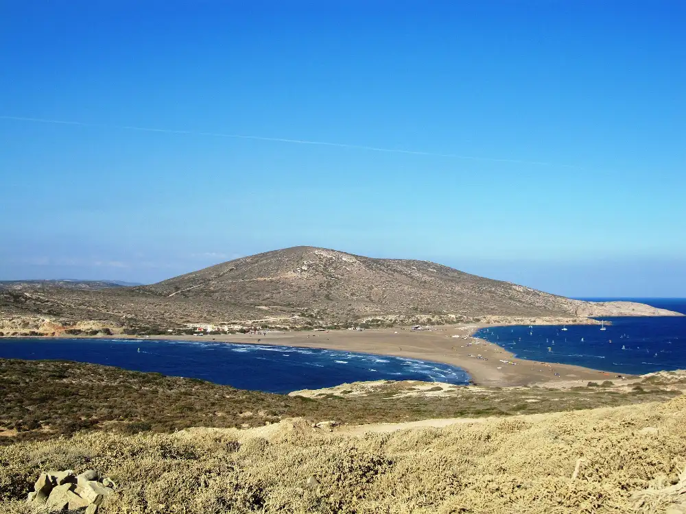 The sandbar at Prasonisi on the southern tip of Rhodes, with choppy open water on one side, calmer water and small sails on the other
