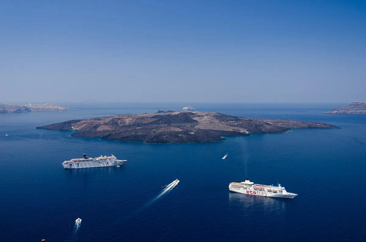 Cruise ships at anchor in the Santorini caldera seen from the cliff-top town far above