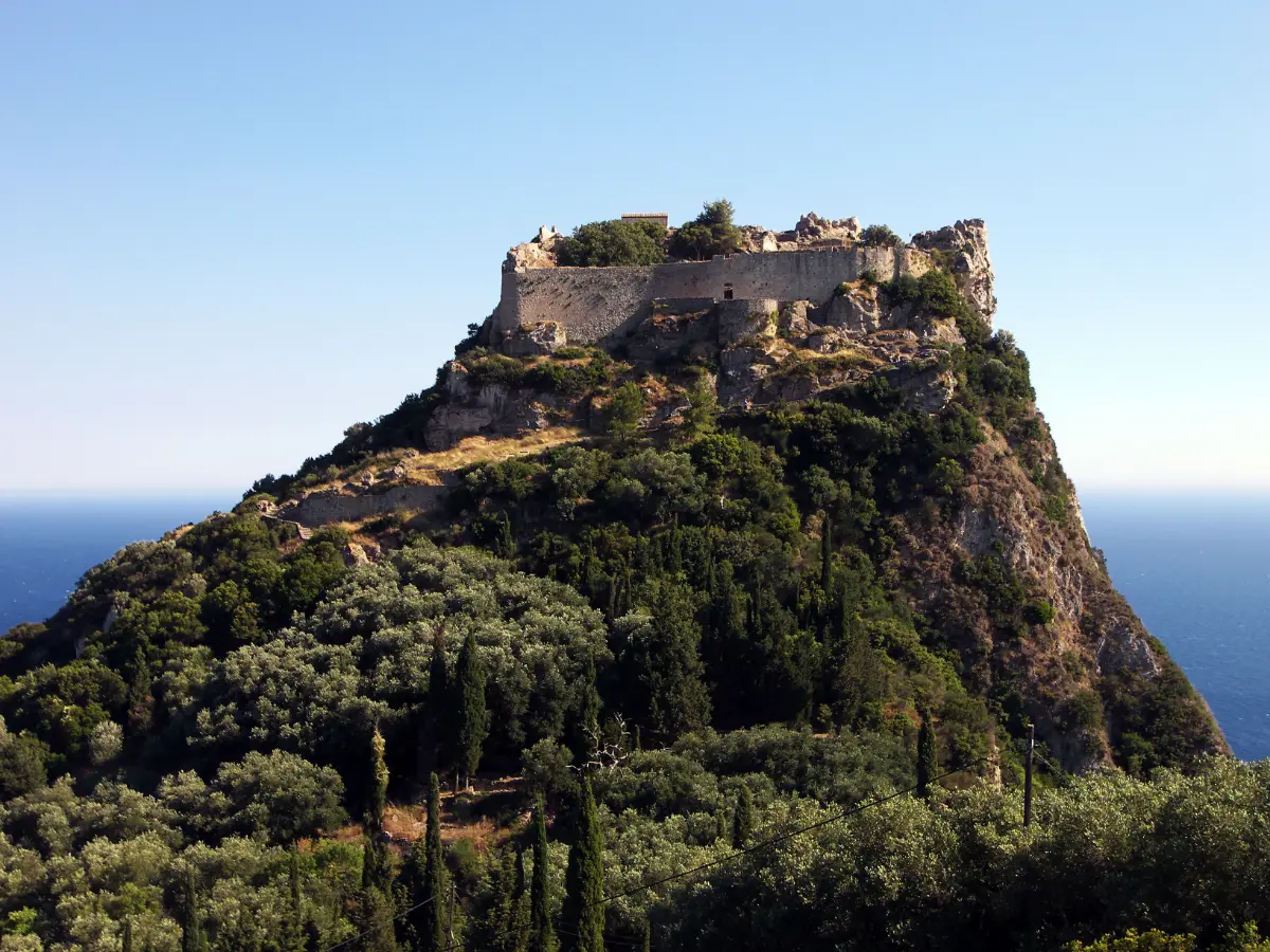 Angelokastro standing on its bare rock above the Corfu coast