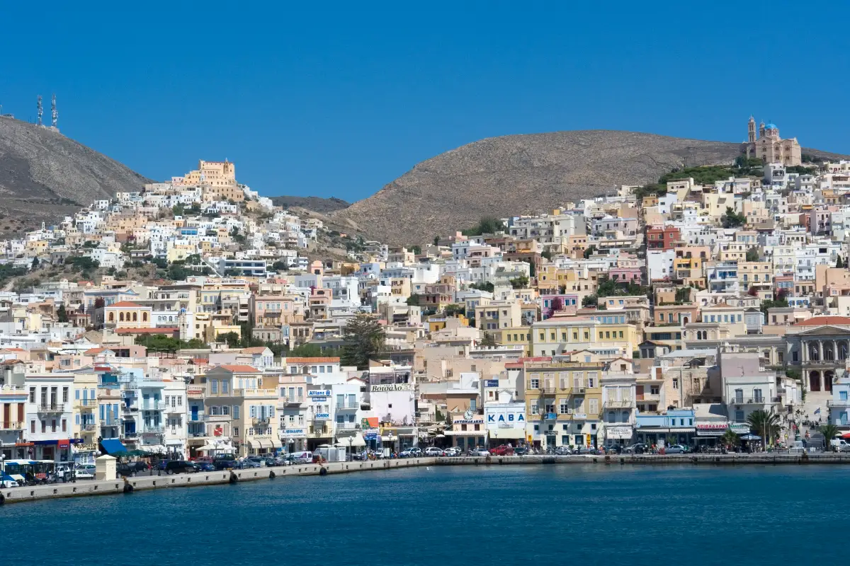 Ano Syros on its hill above Ermoupoli, tiers of pale houses