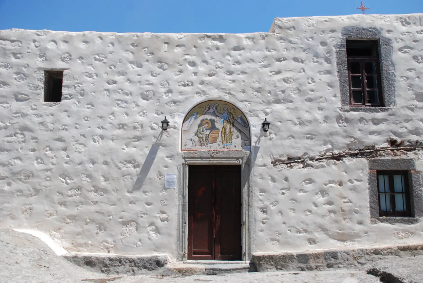 The whitewashed frontage and doorway of the Cave of the Apocalypse on Patmos