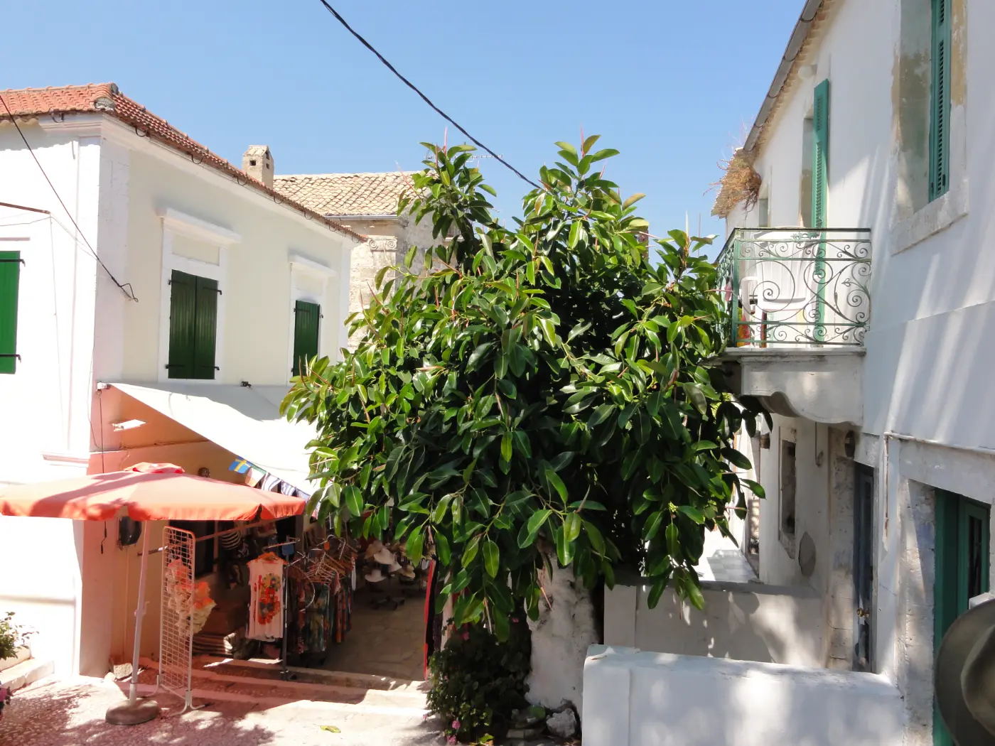 A quiet lane in Fiskardo on Kefalonia between pastel houses