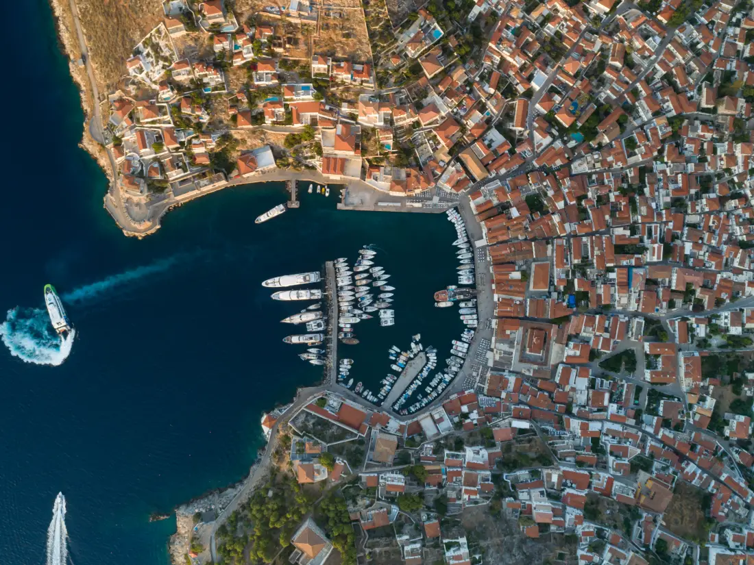 Hydra town from the air, the horseshoe harbour ringed by stone houses