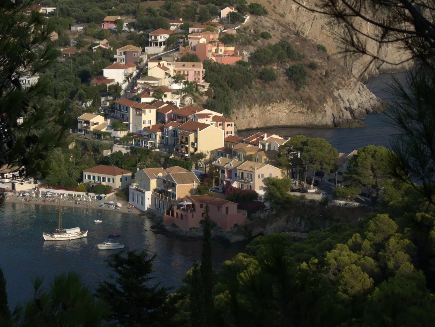 The village of Assos on its isthmus below the wooded headland, Kefalonia