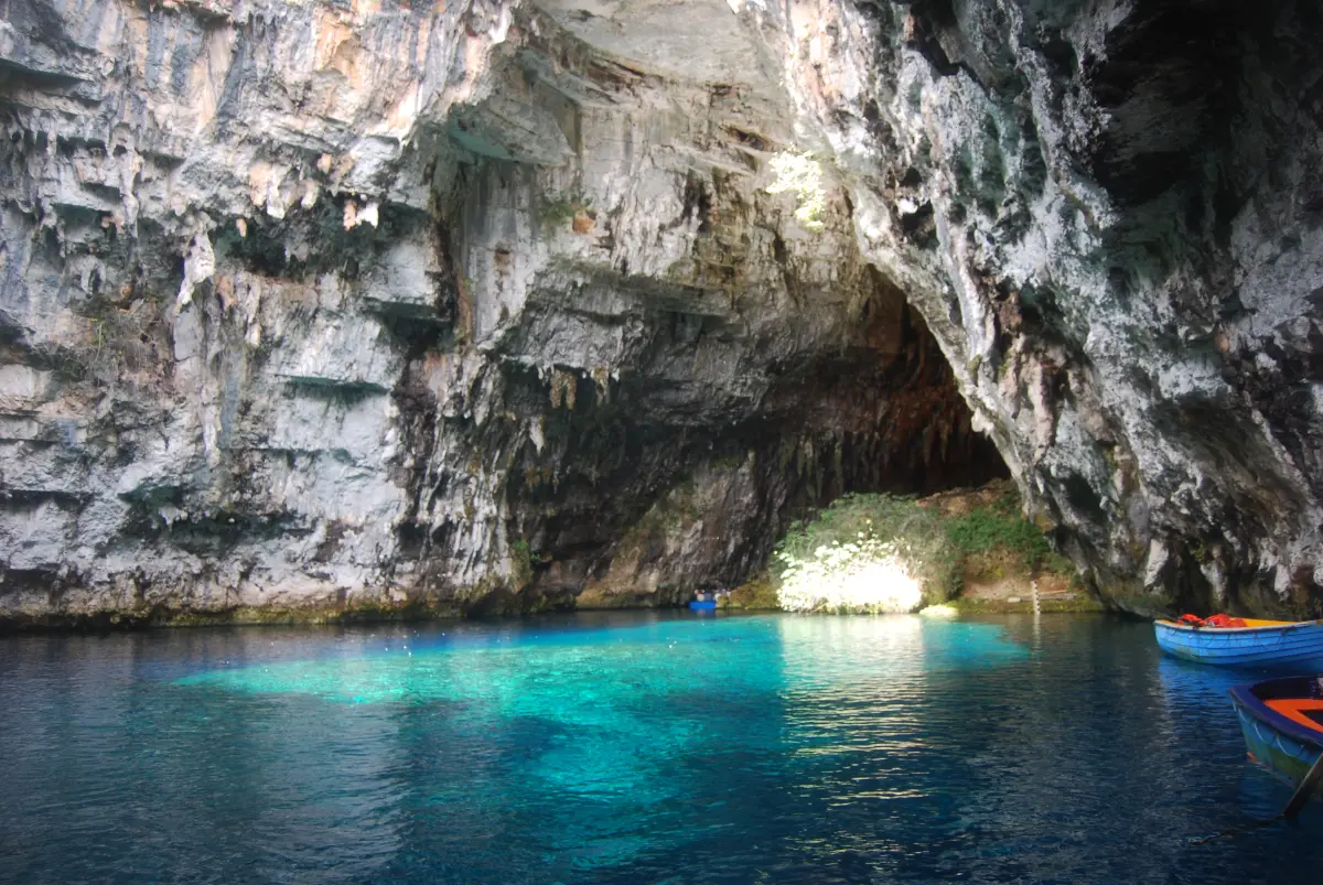 The underground lake of Melissani cave with daylight falling through the collapsed roof
