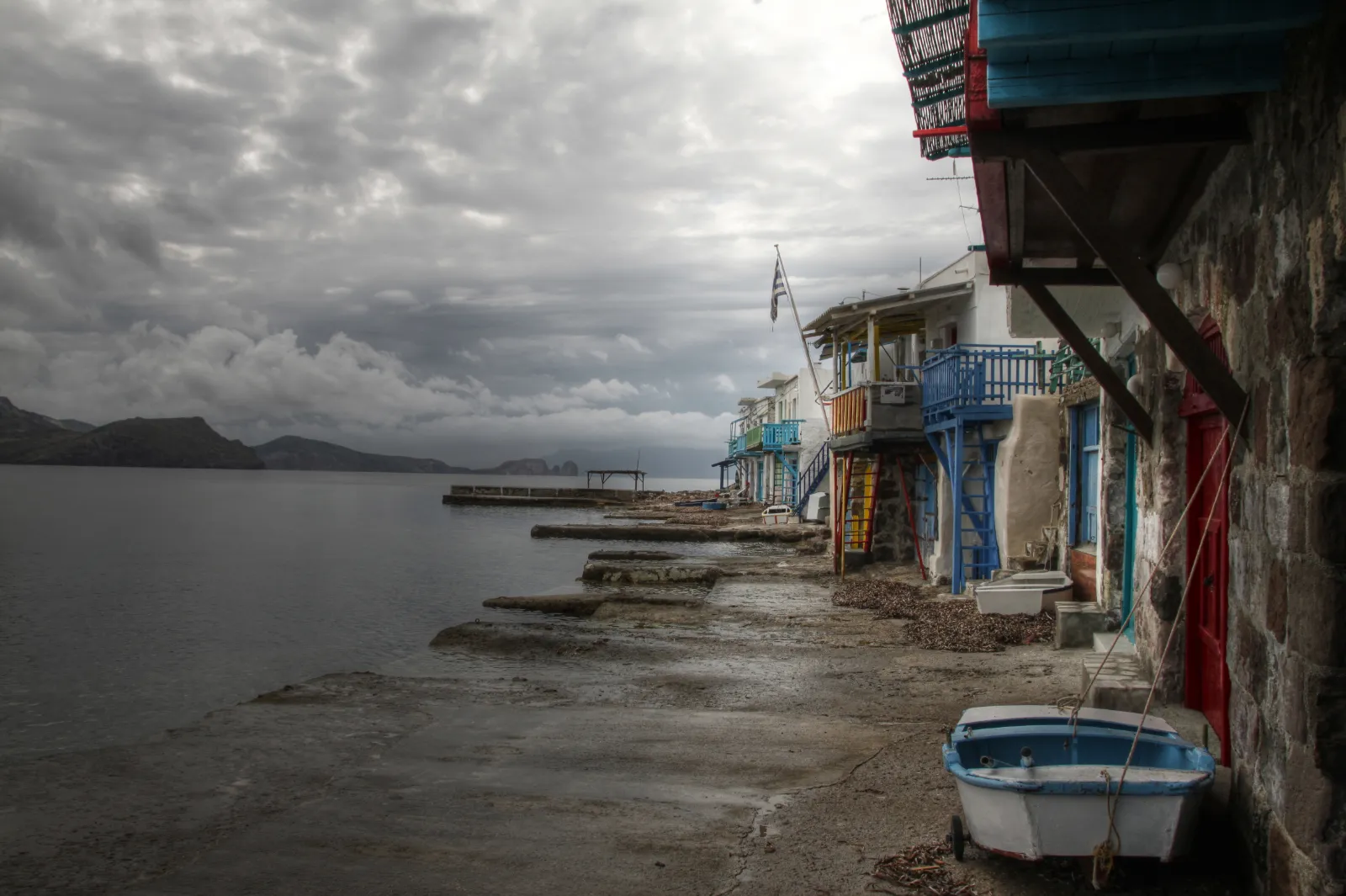 Klima: a village of boat garages under a cliff