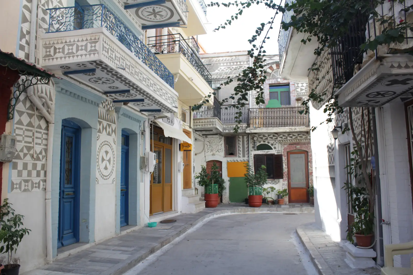 A lane in Pyrgi on Chios between houses cut with grey and white xysta patterns