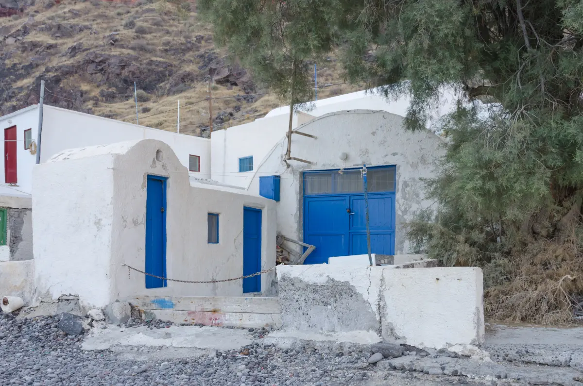 Whitewashed houses with blue doors at Korfos on Thirassia