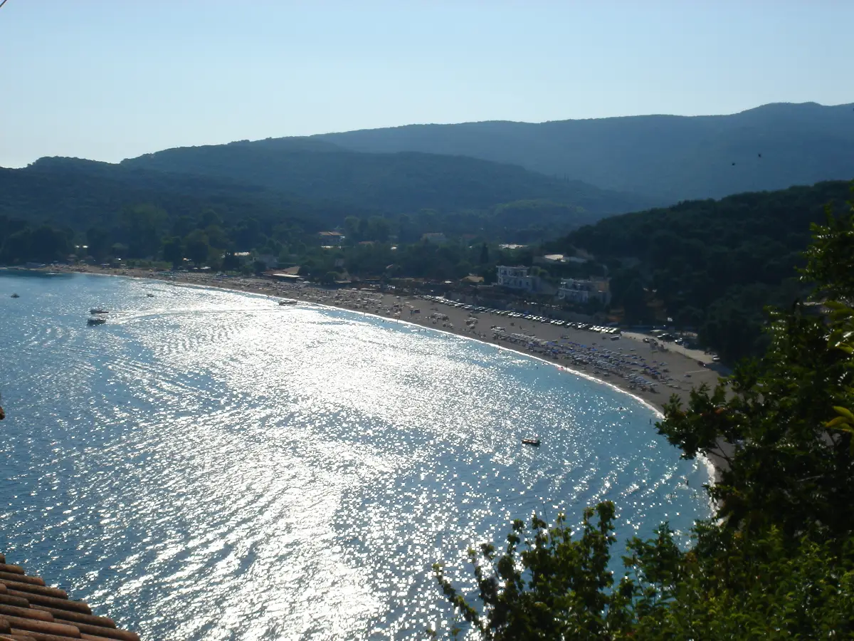 Valtos beach near Parga, a long shingle bay under wooded hills